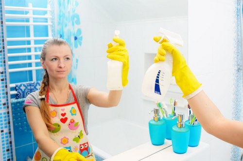 Cleaners assessing a property with safety equipment and insurance-focused procedures