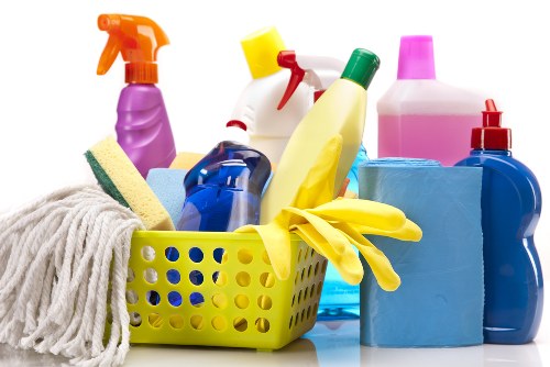 Professional cleaning team working safely with protective equipment